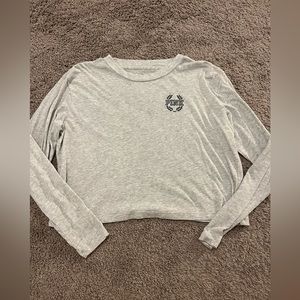 This is a Victoria’s secret Pink CROPPED long sleeve shirt in a size medium.